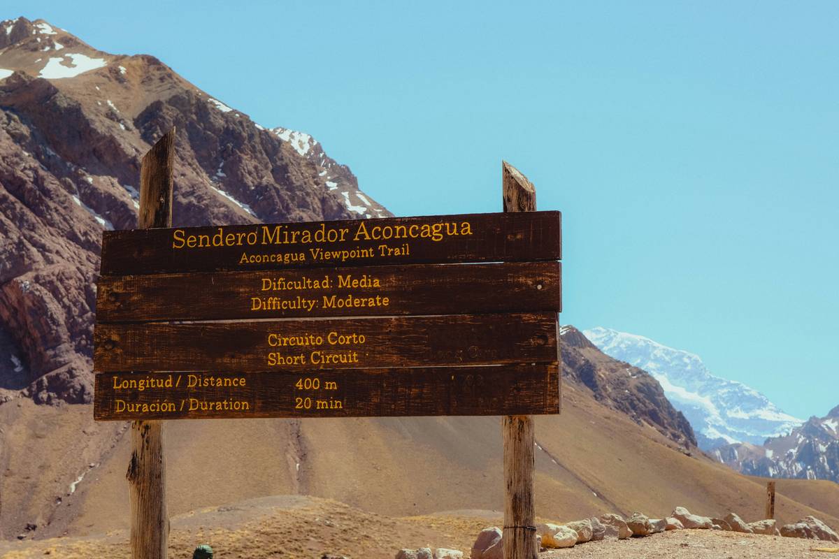 Side-by-side comparison: outdated recreational map vs. current USFS e-bike compliant trail map showing permitted zones, elevation contours, and trail grades